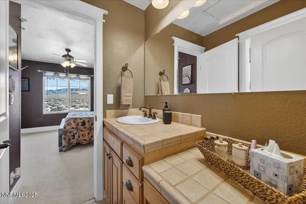 a bathroom with a double vanity sink and mirror