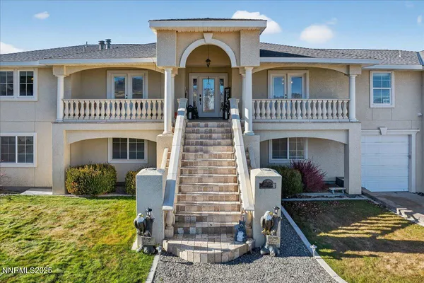 a view of a house with swimming pool and porch