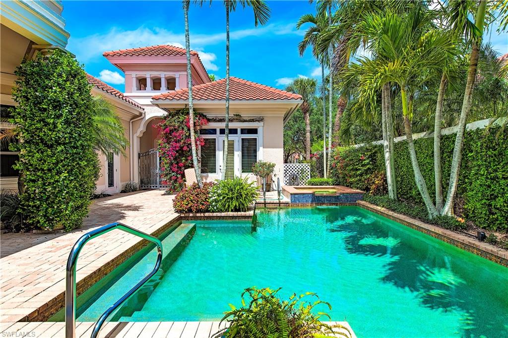 7084 Verde Way Naples, FL 34108 - Photo 3 of 18 a view of a house with backyard porch and sitting area