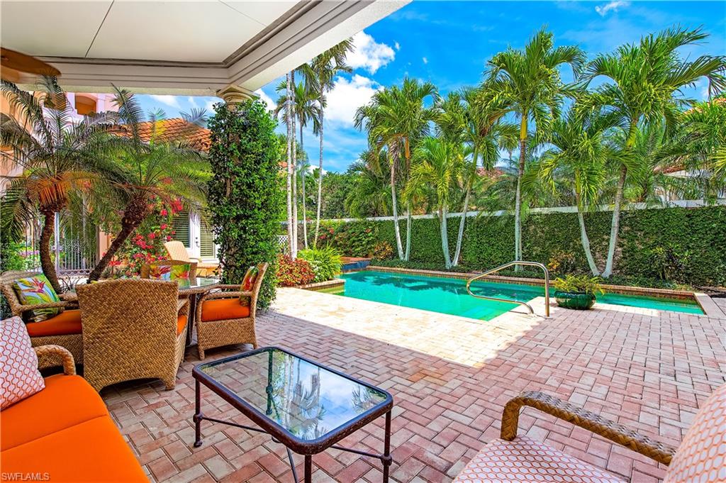 7084 Verde Way Naples, FL 34108 - Photo 5 of 18 a view of a backyard with swimming pool