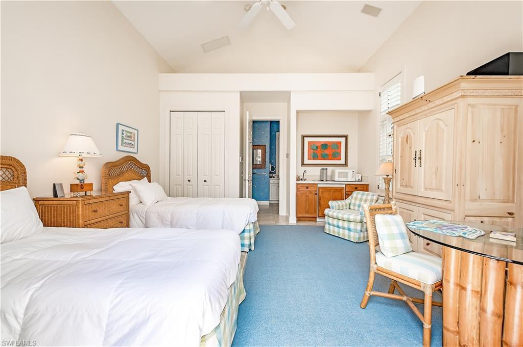 7084 Verde Way Naples, FL 34108 - Photo 6 of 18 a bedroom with bed and furniture