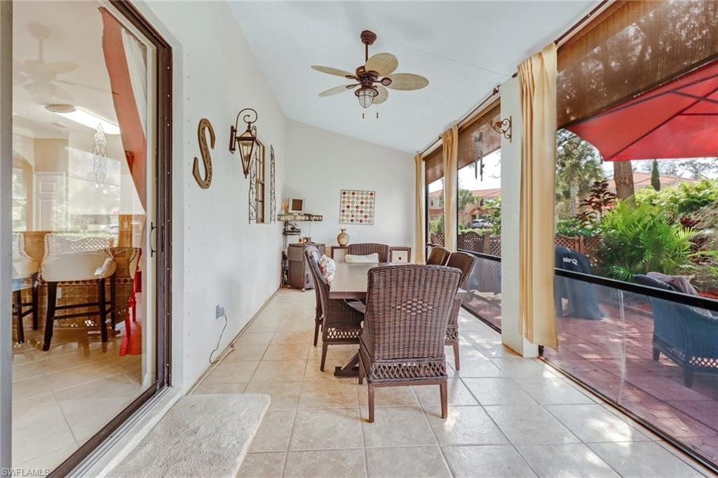 15663 Summit Pl Circle, Unit 328 Naples, FL 34119 - Photo 22 of 32 a view of a dining room with furniture window and outside view