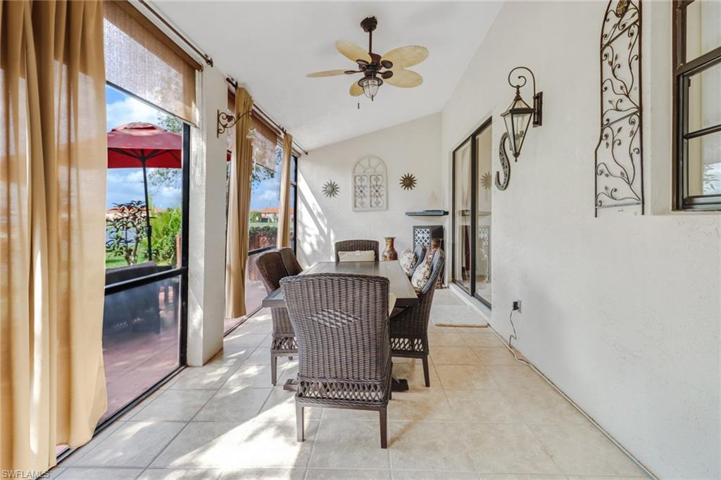 15663 Summit Pl Circle, Unit 328 Naples, FL 34119 - Photo 23 of 32 a dining room with furniture and window
