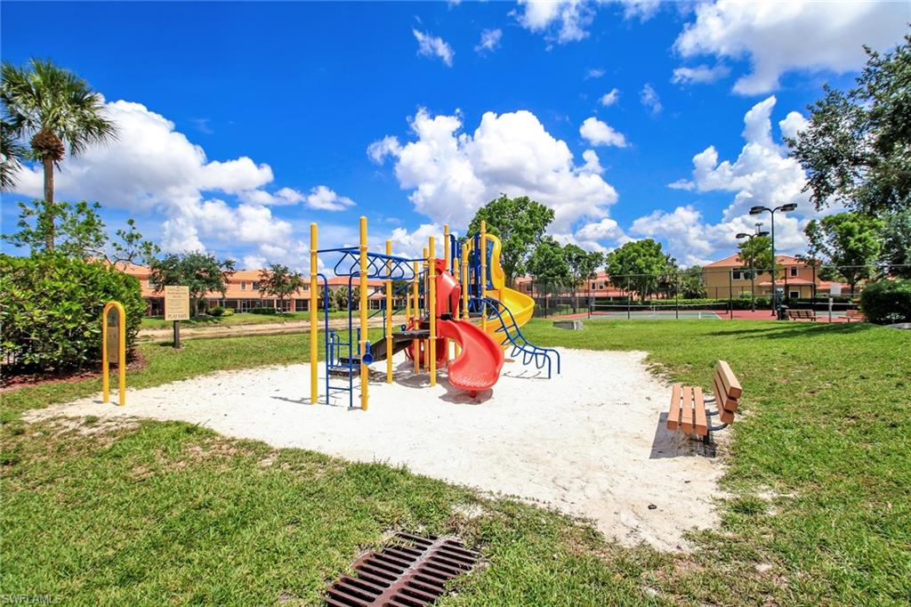15663 Summit Pl Circle, Unit 328 Naples, FL 34119 - Photo 25 of 32 a view of a park with slide