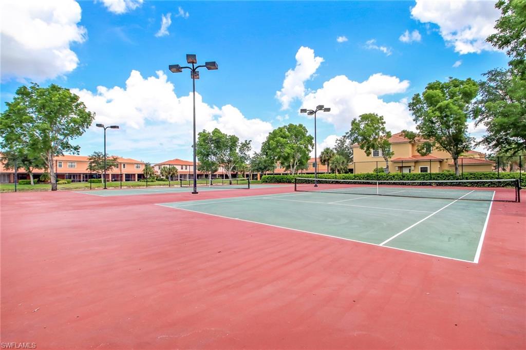 15663 Summit Pl Circle, Unit 328 Naples, FL 34119 - Photo 32 of 32 a view of a tennis court