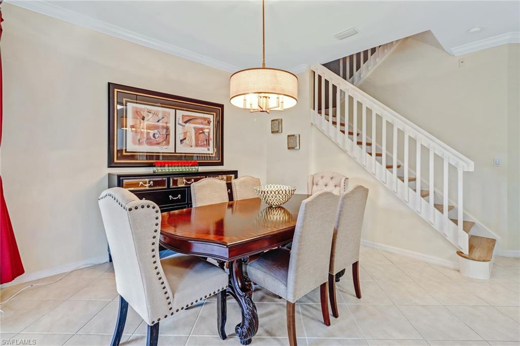 15663 Summit Pl Circle, Unit 328 Naples, FL 34119 - Photo 8 of 32 a dining room with furniture and entryway