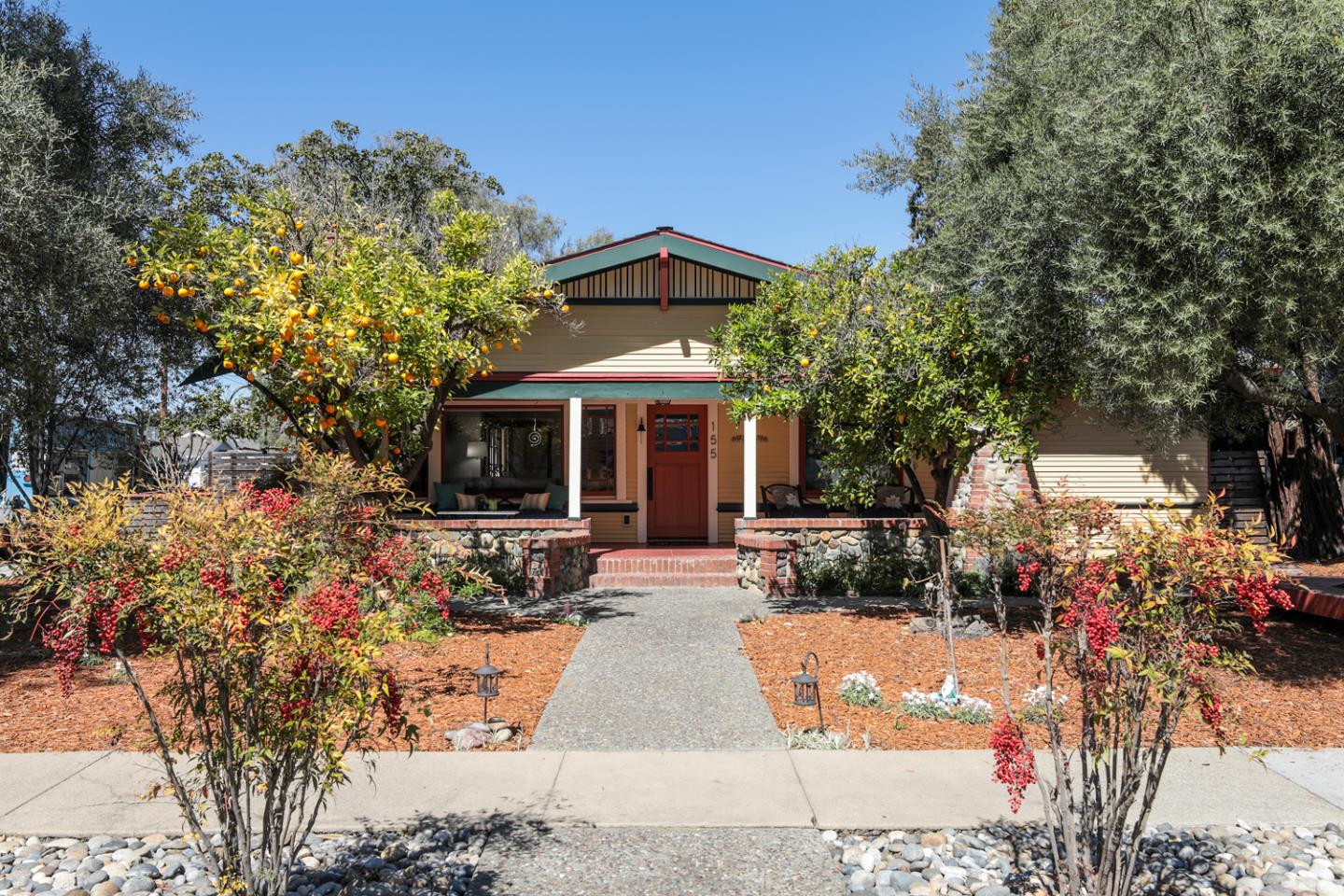 a view of a house with sitting area and garden