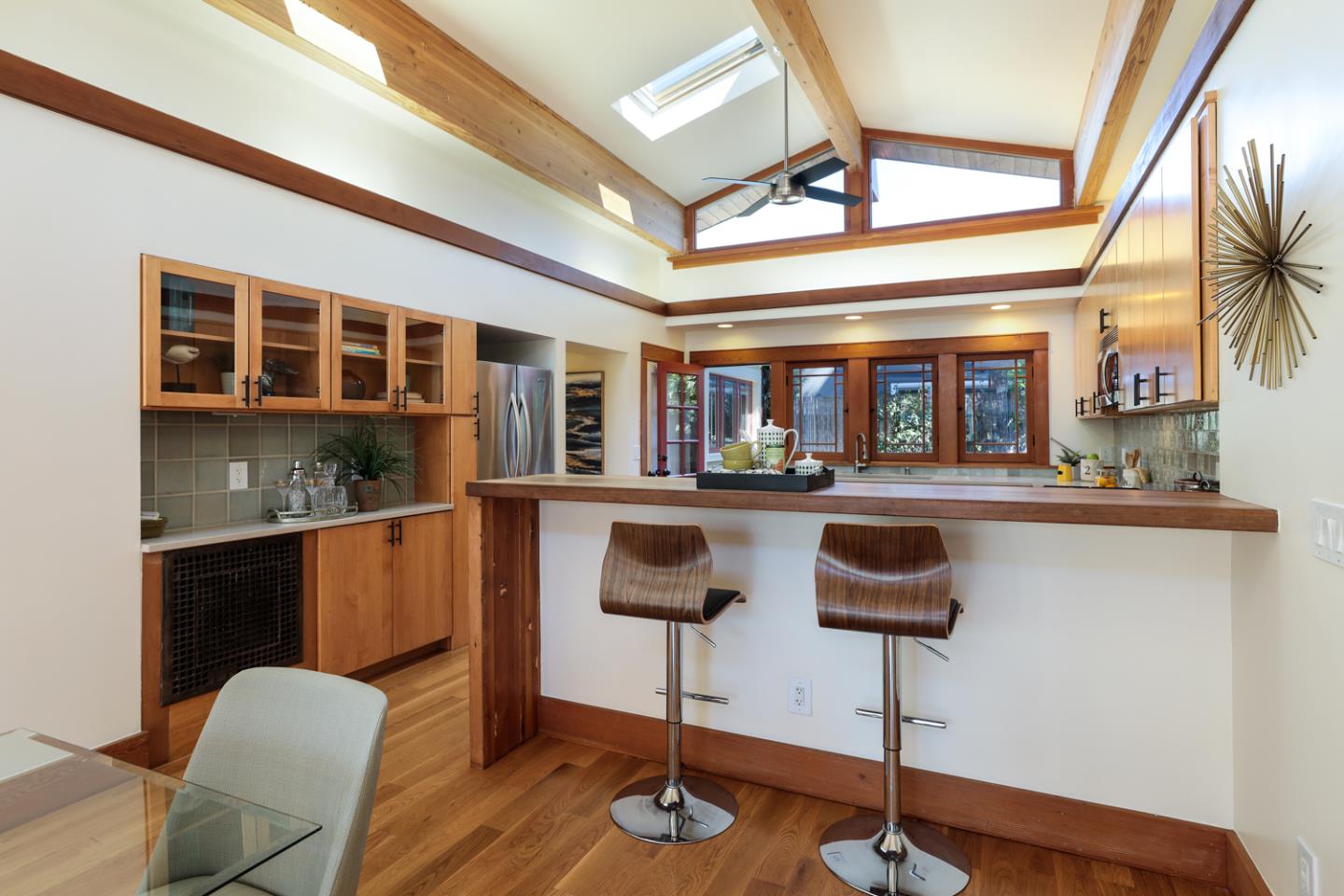 155 Alice Avenue Campbell, CA 95008 - Photo 10 of 36 a kitchen with stainless steel appliances kitchen island granite countertop a table chairs in it and wooden floors