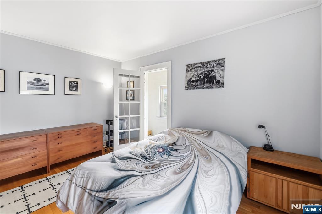 69 Sussex Road Tenafly, NJ 07670 - Photo 29 of 39 a bedroom with a bed and a window