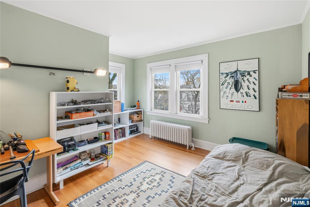 69 Sussex Road Tenafly, NJ 07670 - Photo 30 of 39 a bedroom with furniture and a window