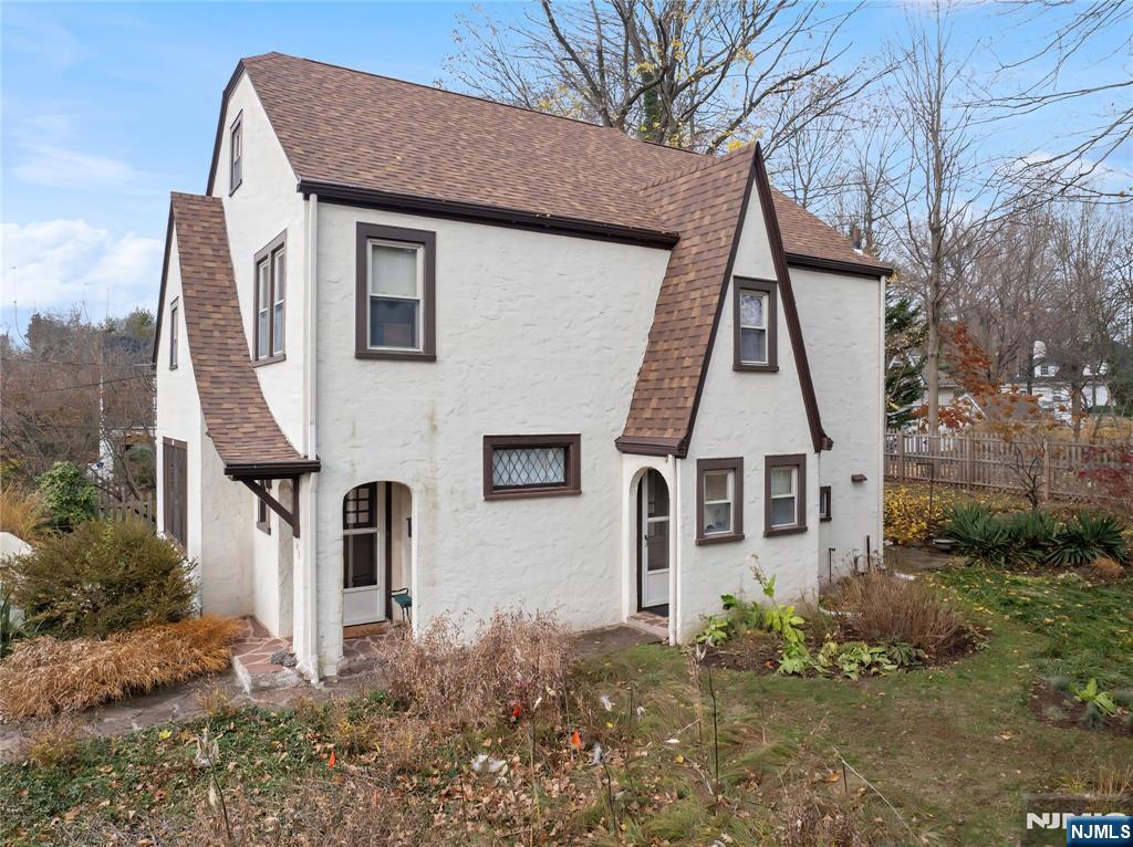69 Sussex Road Tenafly, NJ 07670 - Photo 4 of 39 an aerial view of a house with a yard