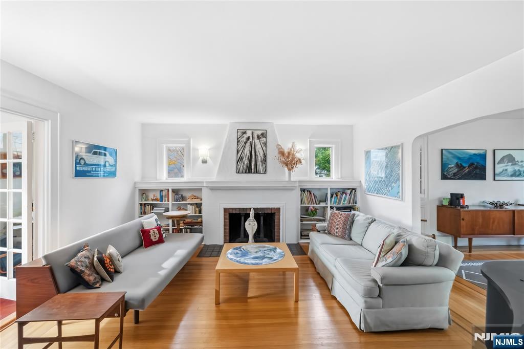 69 Sussex Road Tenafly, NJ 07670 - Photo 7 of 39 a living room with furniture and a fireplace