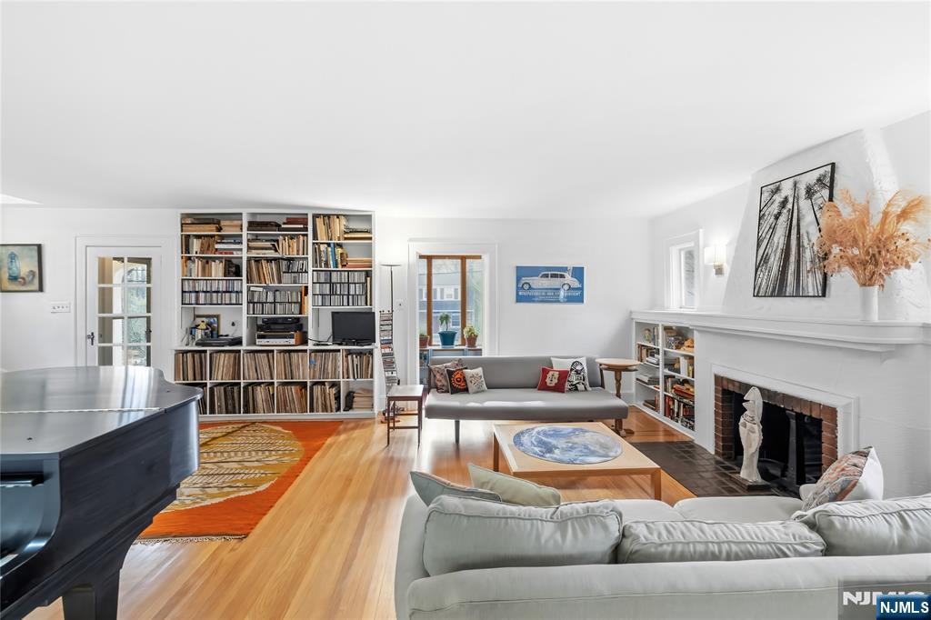 69 Sussex Road Tenafly, NJ 07670 - Photo 8 of 39 a living room with furniture and a fireplace