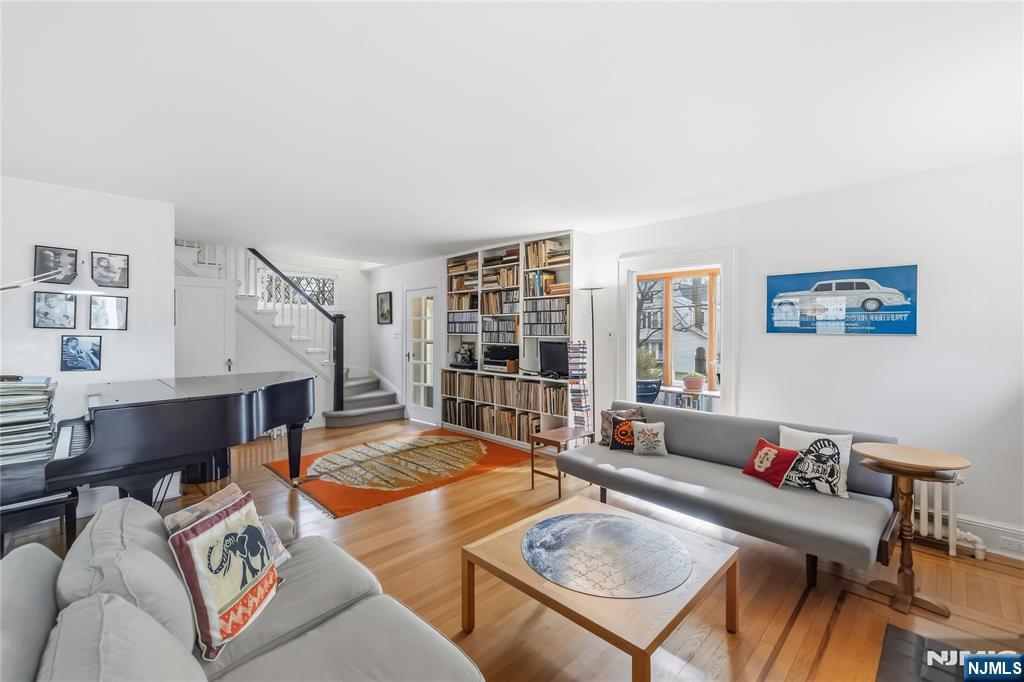 69 Sussex Road Tenafly, NJ 07670 - Photo 10 of 39 a living room with furniture and a table