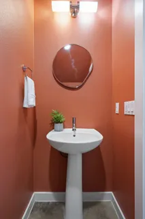 a bathroom with a sink and mirror