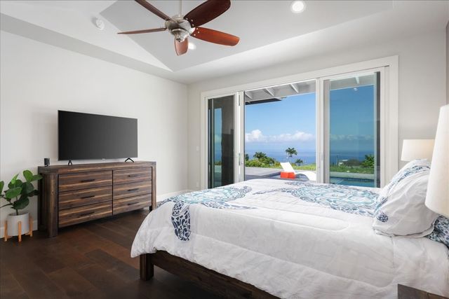 a bathroom with a tub shower vanity and a sink