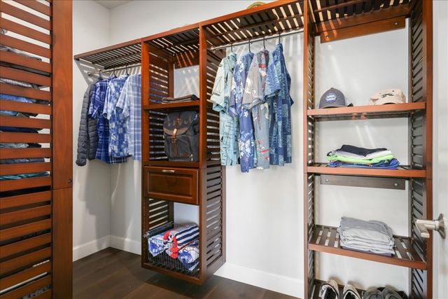 a bedroom with a bed and a potted plant