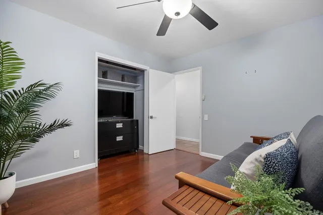a dining space with wooden floor and city view