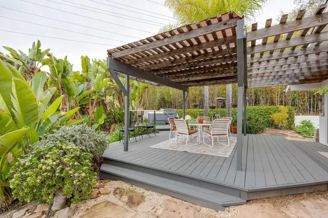a view of a chairs and table in a patio
