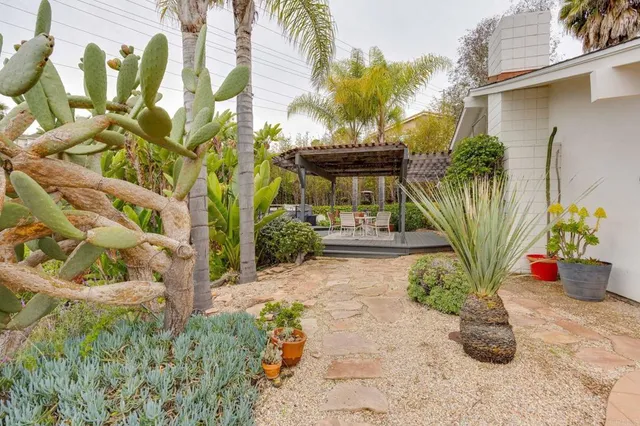 a view of a chairs and table in the patio