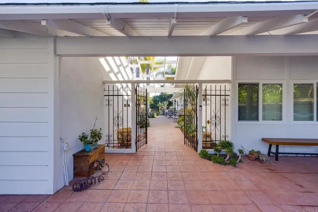 a view of a pathway of a garden with potted plants