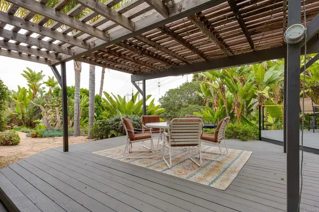 an aerial view of residential houses with outdoor space and swimming pool