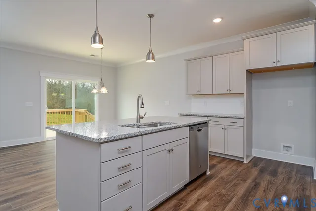 a kitchen with sink and cabinets