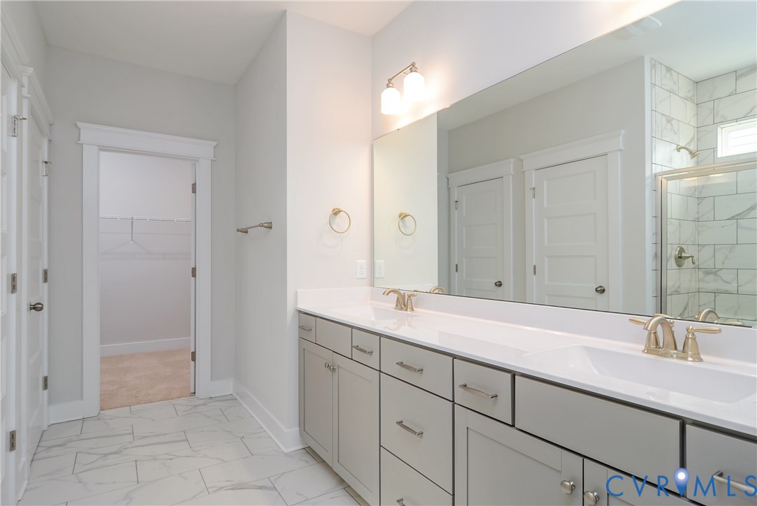 2004 Swiss Lane Hayes, VA 23072 - Photo 8 of 10 a bathroom with a sink and a mirror