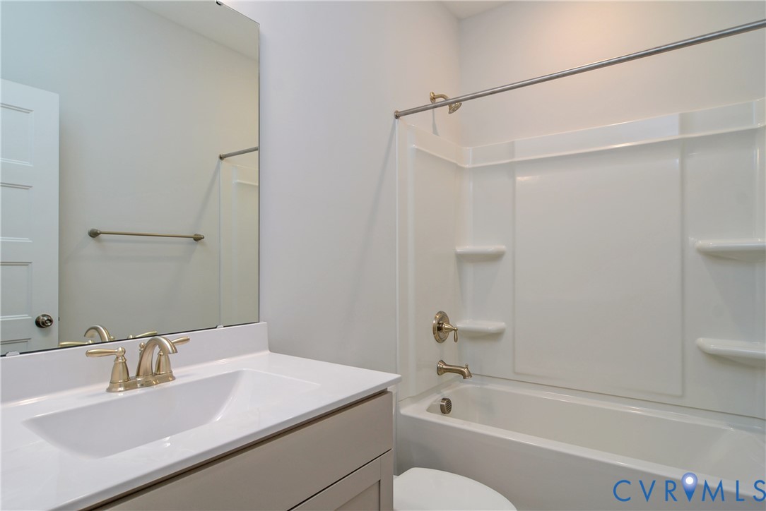 2004 Swiss Lane Hayes, VA 23072 - Photo 10 of 10 a bathroom with a sink toilet vanity and shower