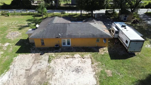 a aerial view of a house with a yard