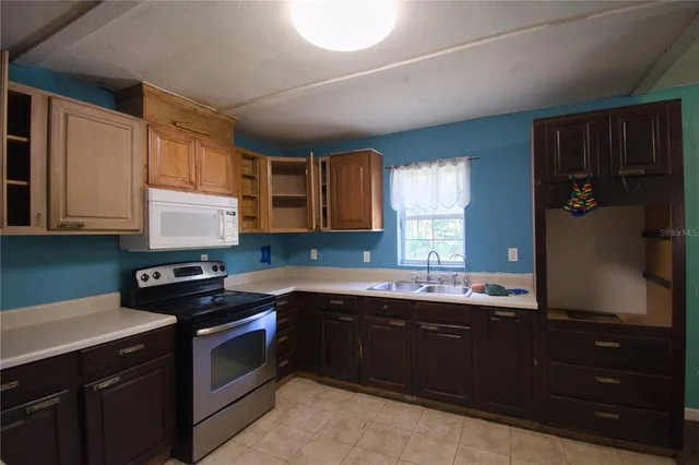 a kitchen with a sink and cabinets