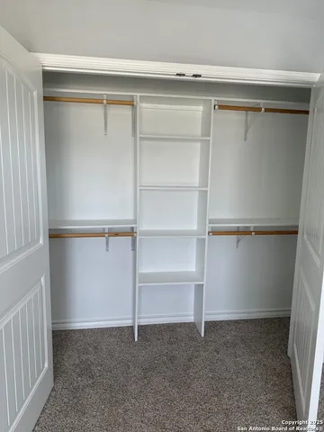a view of an empty walk in closet