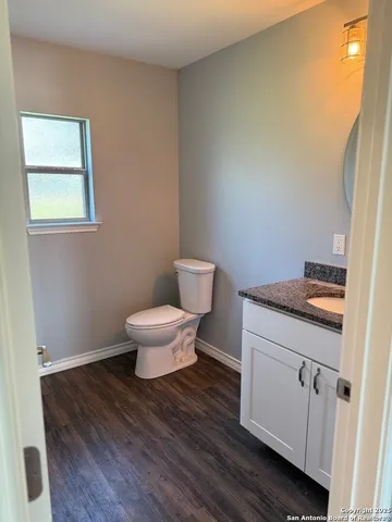 a bathroom with a toilet and a sink