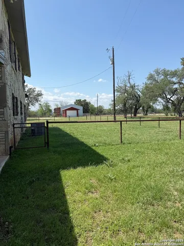 a view of a golf course with a lake view
