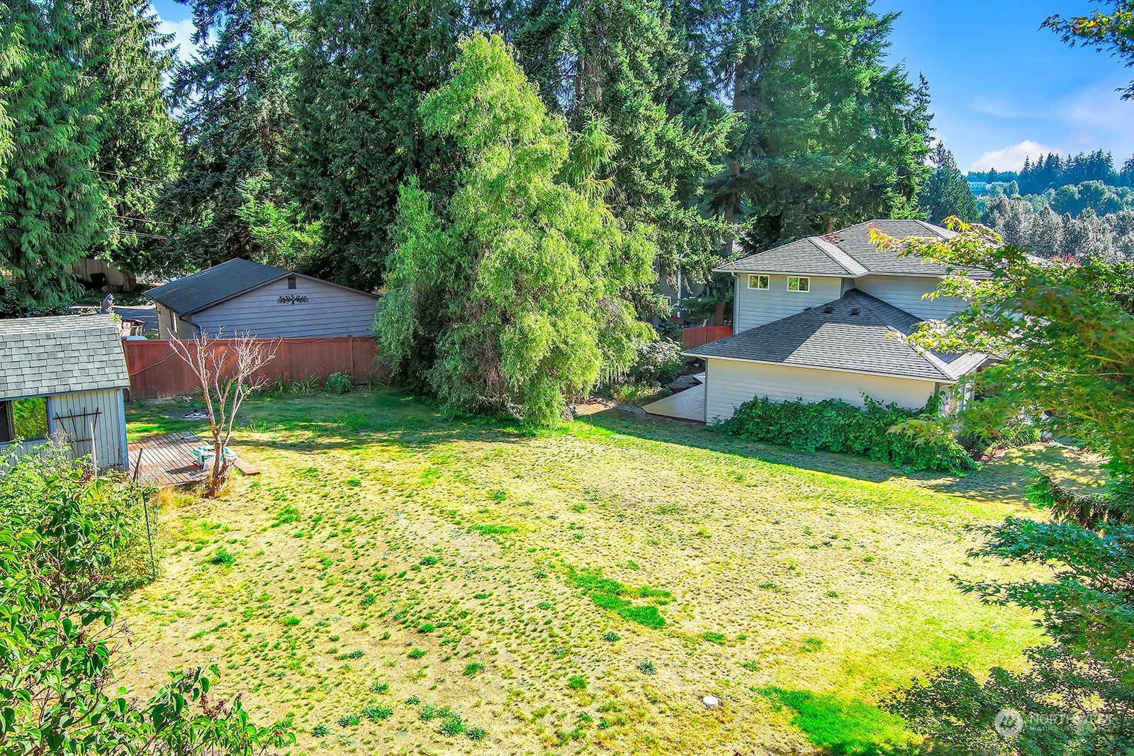 215 173rd Place Southeast Bothell, WA 98012 - Photo 36 of 40 a aerial view of a house with a yard and trees