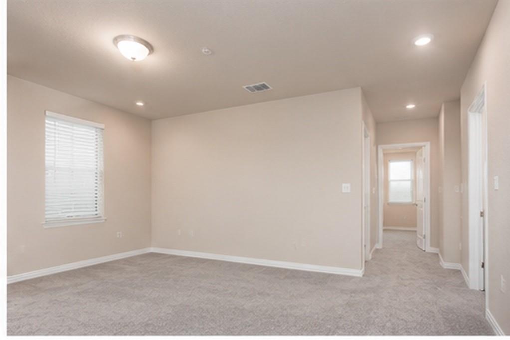 3704 Banton Street Rowlett, TX 75089 - Photo 12 of 16 Spacious room with neutral-toned walls, recessed lighting, and a flush-mount ceiling fixture