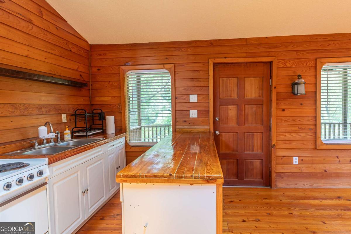 1656-t O To Jones Road Reidsville, GA 30453 - Photo 11 of 22 a kitchen with stainless steel appliances granite countertop a stove a sink and dishwasher