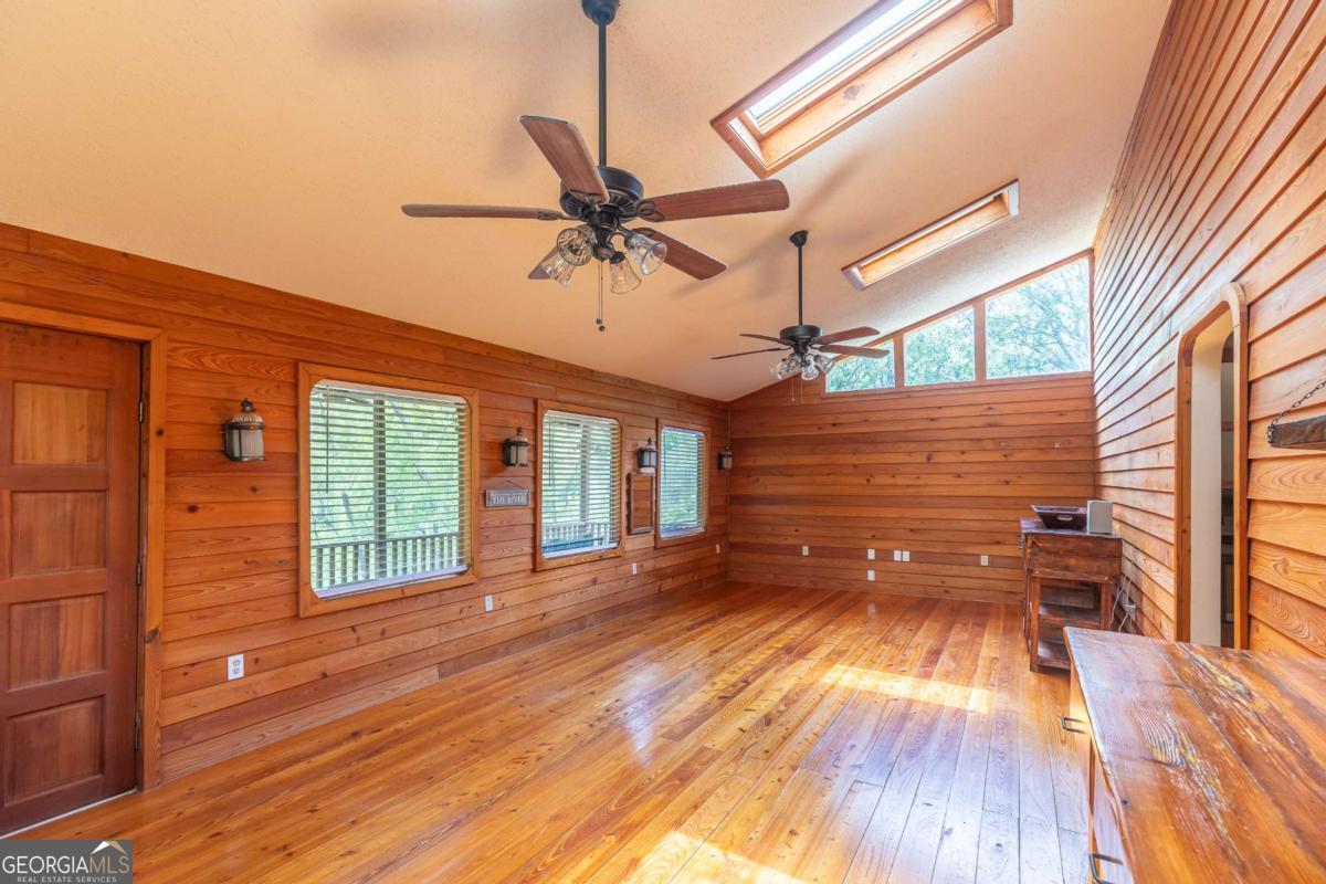 1656-t O To Jones Road Reidsville, GA 30453 - Photo 12 of 22 a view of empty room with wooden floor and fan
