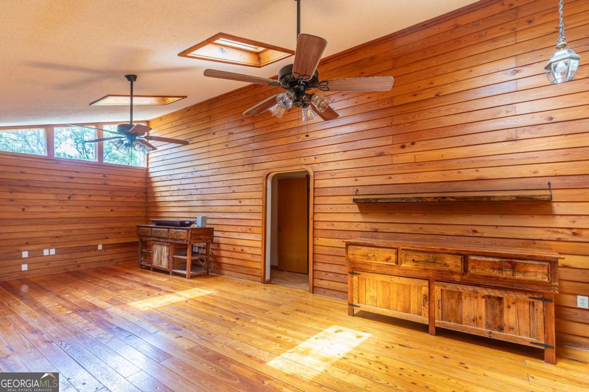 1656-t O To Jones Road Reidsville, GA 30453 - Photo 14 of 22 a view of a chairs and table on the wooden floor