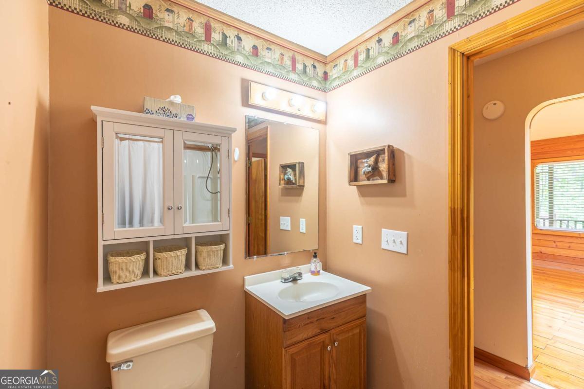 1656-t O To Jones Road Reidsville, GA 30453 - Photo 16 of 22 a bathroom with a sink a toilet and a mirror