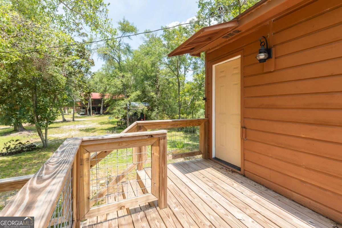 1656-t O To Jones Road Reidsville, GA 30453 - Photo 20 of 22 a view of balcony with wooden floor
