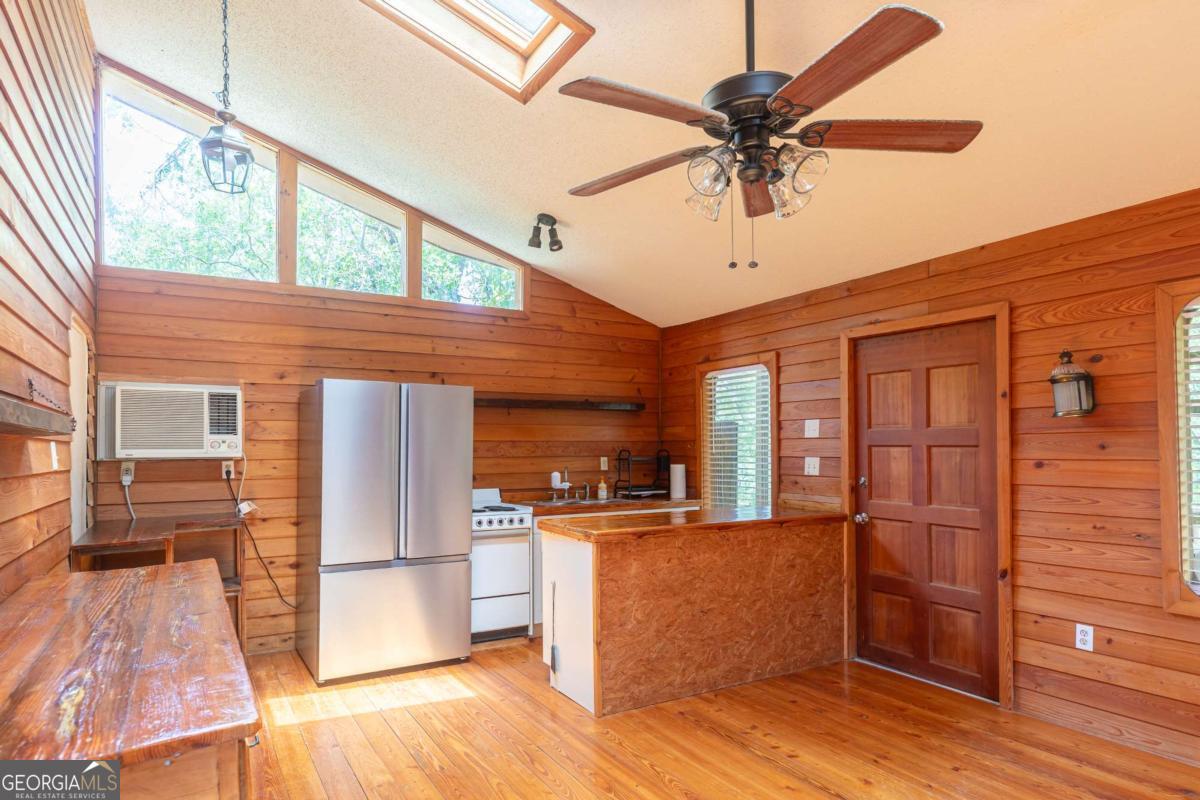 1656-t O To Jones Road Reidsville, GA 30453 - Photo 10 of 22 a view of a living room with furniture and wooden floor