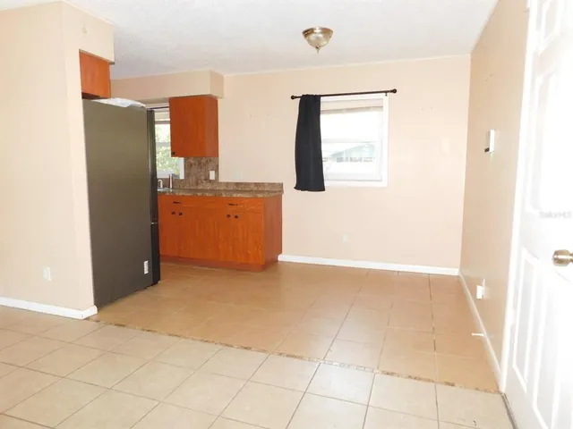 a view of kitchen with furniture and cabinets