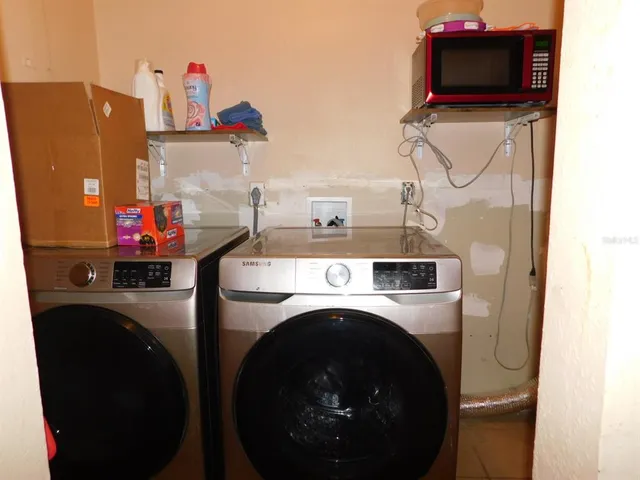 a utility room with dryer and washer