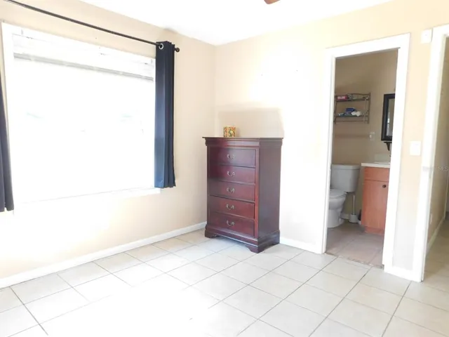 a bathroom with a sink a toilet and a shower