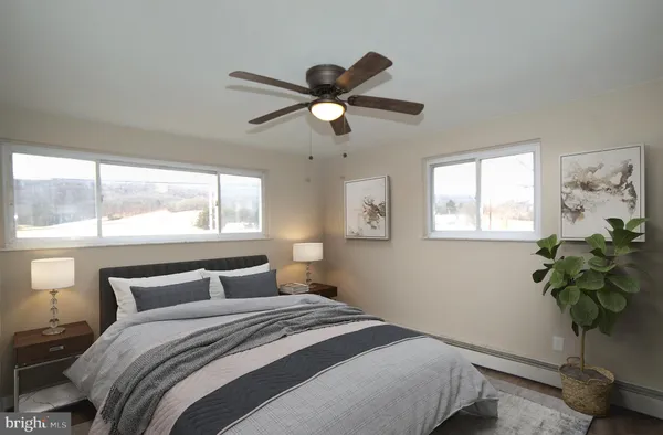 a bedroom with a bed and a window