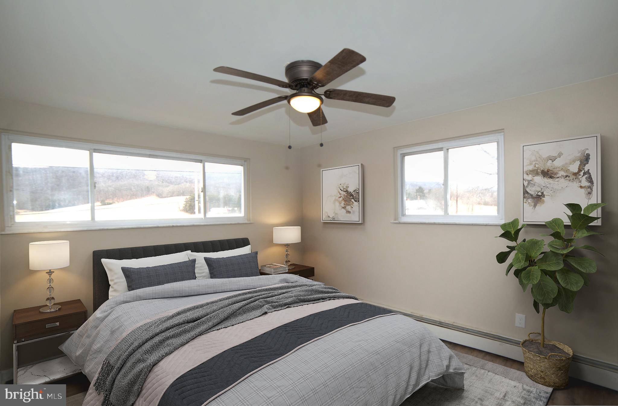 2226 Hyndman Road Hyndman, PA 15545 - Photo 13 of 15 a bedroom with a bed and a window