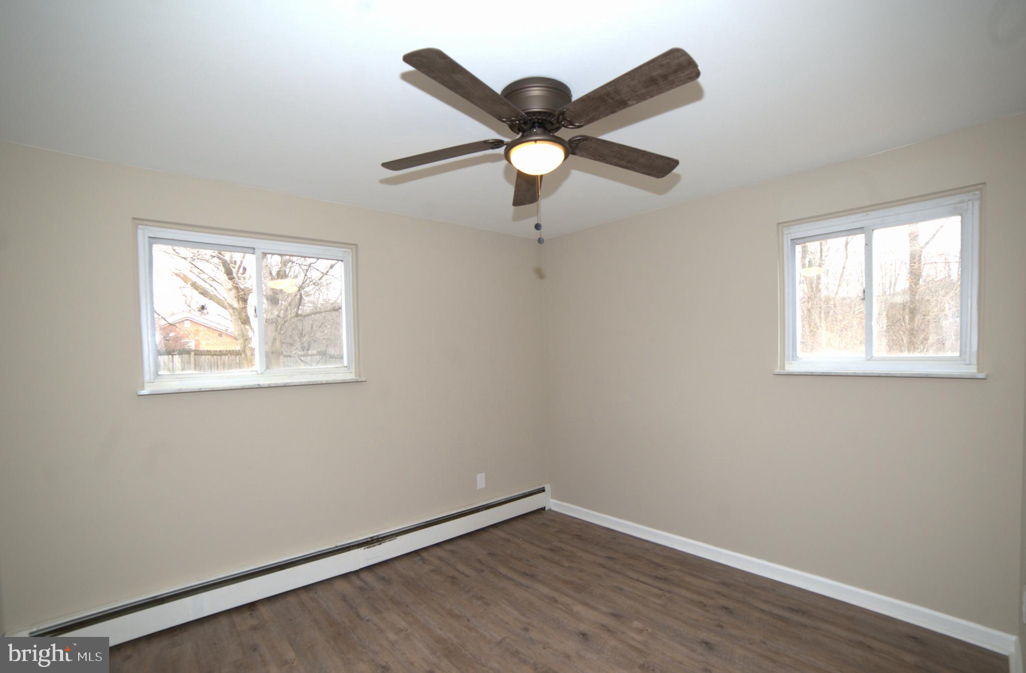 2226 Hyndman Road Hyndman, PA 15545 - Photo 14 of 15 a view of an empty room with wooden floor and a window