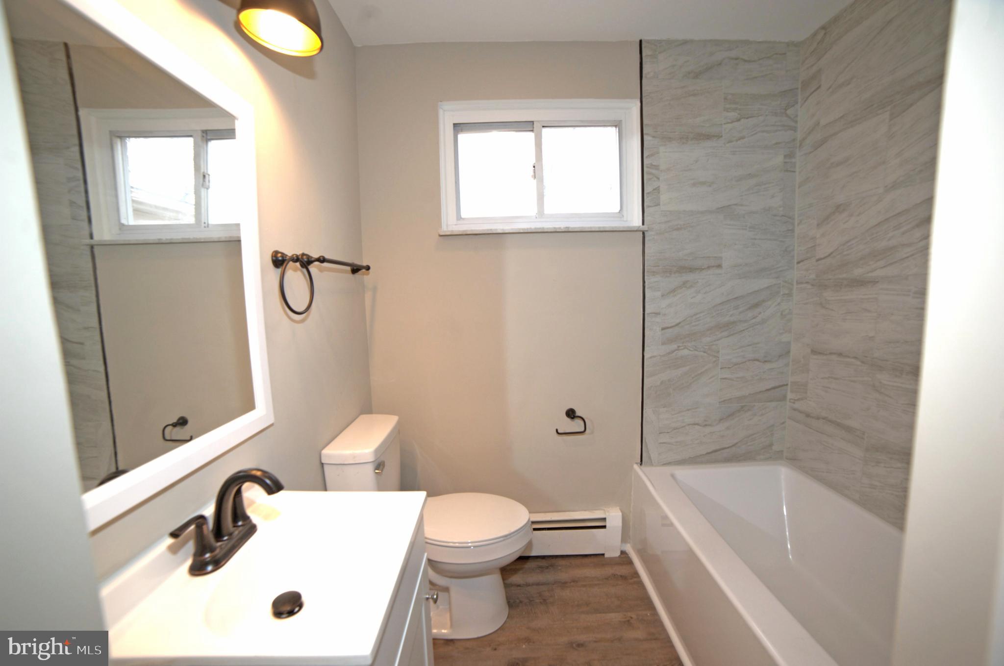 2226 Hyndman Road Hyndman, PA 15545 - Photo 15 of 15 a bathroom with a sink a toilet and shower