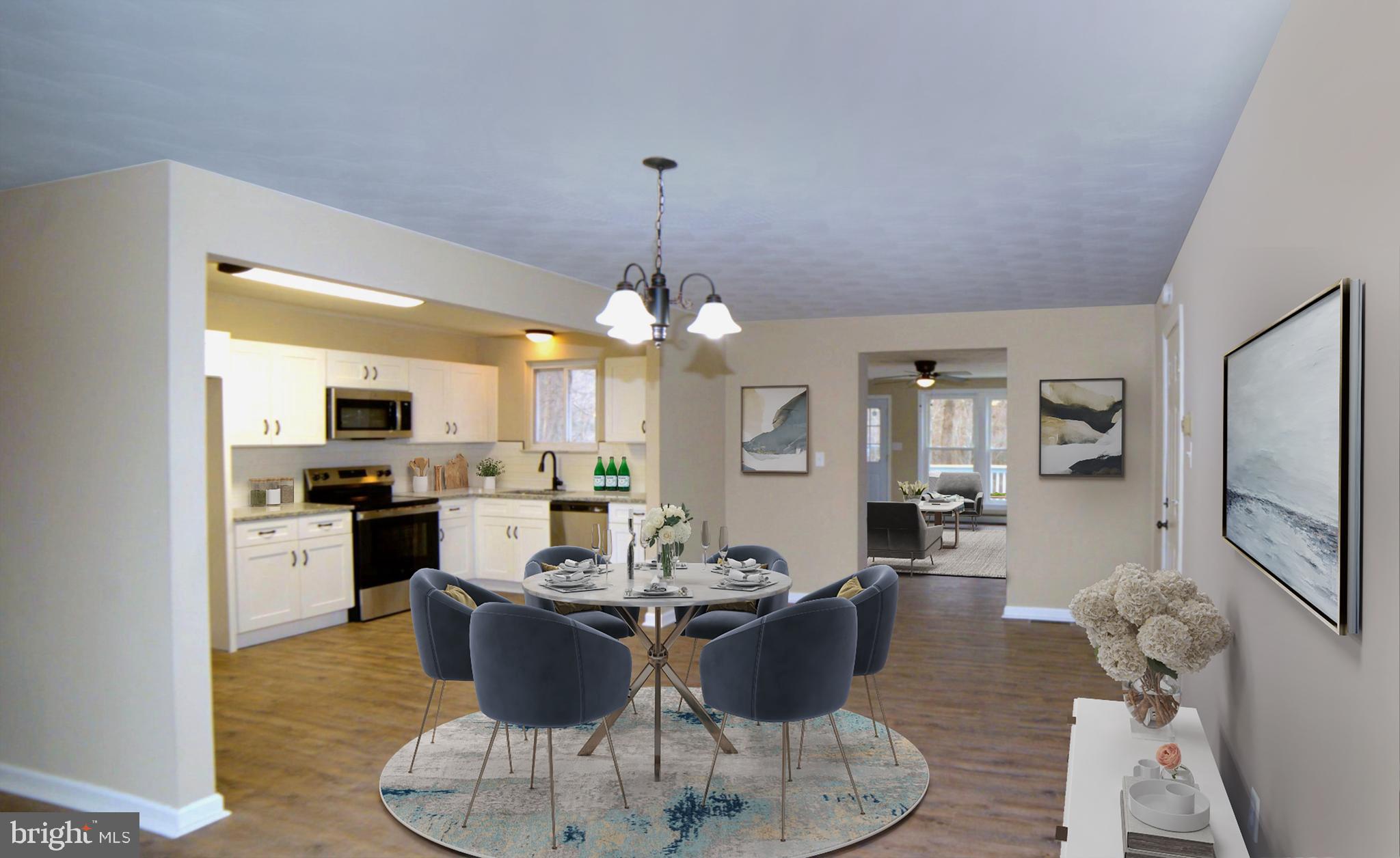 2226 Hyndman Road Hyndman, PA 15545 - Photo 9 of 15 a view of a dining room with furniture a chandelier and wooden floor